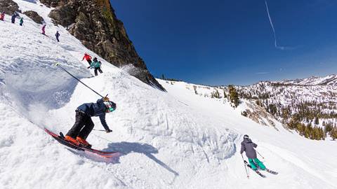 Teenagers skiing through the banked slalom off Shirley Lake in April 2021