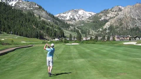 Someone teeing off at the resort at squaw creek