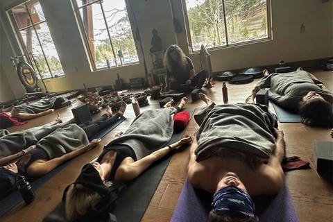 Yoga class working on breathwork meditation