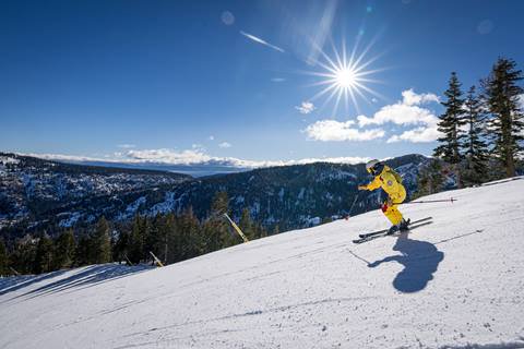 Skier on groomed slope at Palisades Tahoe