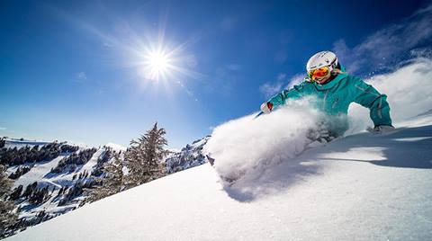 Amie Engerbretson skis at Palisades Tahoe on a powder day. 