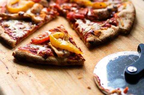 Pizza on cutting board.