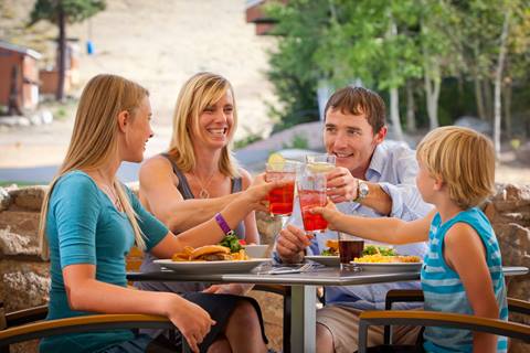 Family enjoying a meal at Rocker in the summertime