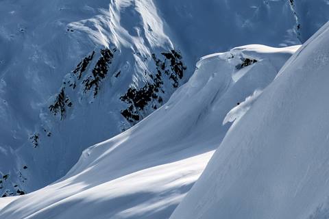 Travis Ganong free skiing in Alaska, captured by AK.