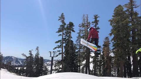 Snowboarder doing trick.