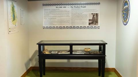 The Washoe Display at High Camp, showing a display case and associated signs.