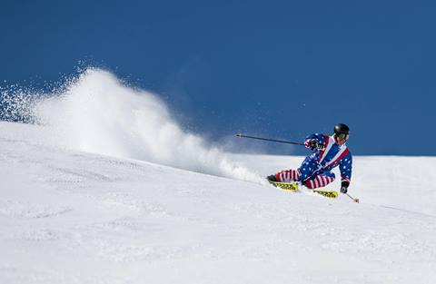 Jonny Moseley skiing on a blue bird day at Palisades Tahoe