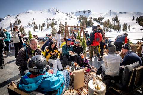 Group of people hangout outside at Palisades Tahoe