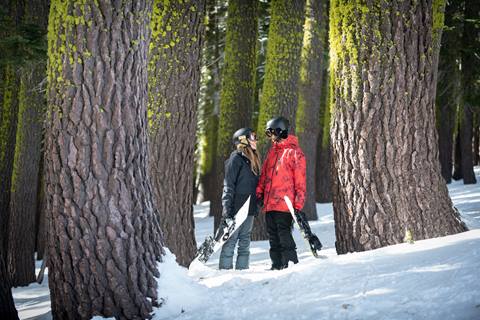 Couple smiling in lakeview trees