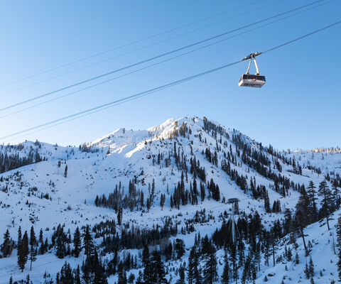 Palisades Tahoe Aerial Tram going up the mountain for Sunset Happy Hour