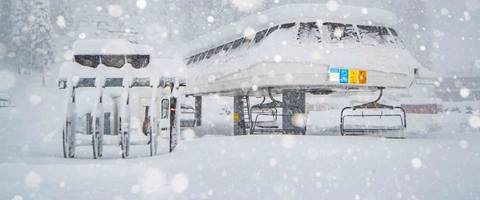 Photo of the base of the KT-22 chairlift on a powder Day at Palisades Tahoe. 