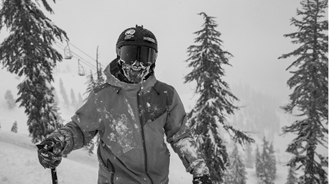 Travis Ganong smiling on a powder day