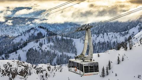 Palisades Tahoe Tram surrounded by picturesque mountains covered in snow