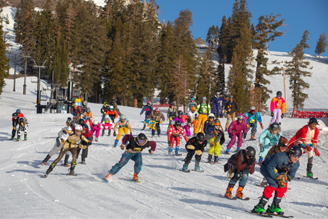 Group skiers in fun costumes