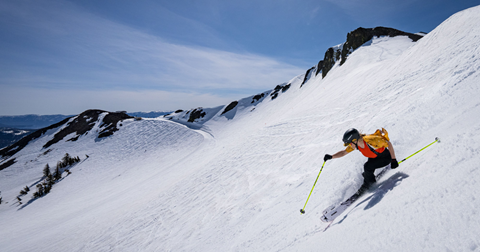 Skier on sunny bluebird day