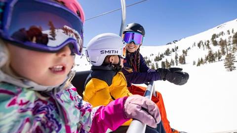 Mountain Sports School kids riding a chairlift at Palisades Tahoe.