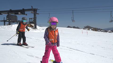 Two kids taking a Mountain Sports School Lesson at Palisades Tahoe. 