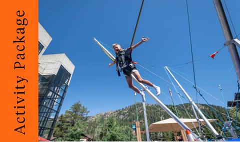 A child participating in the bungee trampoline in The Village at Palisades Tahoe. 