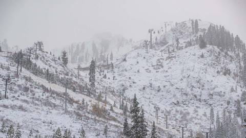 A light blanket of new snow covers KT-22 chairlift at Palisades Tahoe.