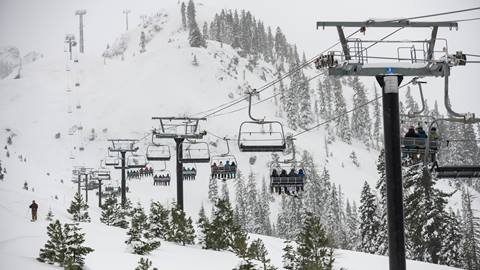 Chairlift in new snow on a stormy day