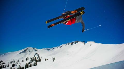 Skier in the Palisades Terrain Park in the air. 