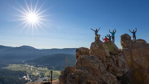 Group climbing the Tahoe Via Ferrata at Palisades Tahoe in summer