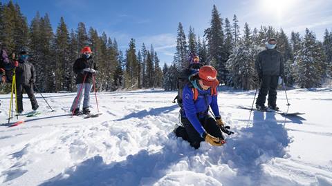 Alpenglow Expeditions Instructor demonstrates using a beacon in training