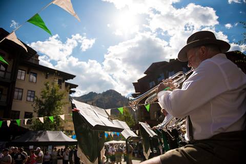 A man plays the trumpet at Oktoberfest.