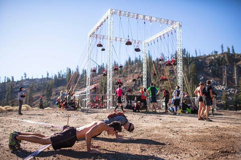 Competitors participate in an obstacle challenge at a Spartan Race in Olympic Valley, California. 