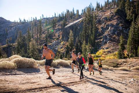 Competitors participate in an obstacle challenge at a Spartan Race in Olympic Valley, California. 