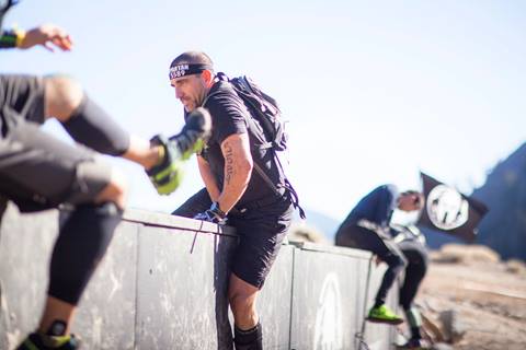 Competitors participate in an obstacle challenge at a Spartan Race in Olympic Valley, California. 