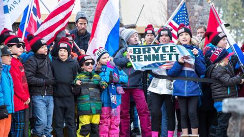 A fan holds up a sign for Olympian and Palisades Tahoe athlete Bryce Bennett. 