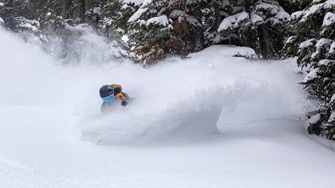 Skier spraying powder on Pete's Peril at Alpine Meadows