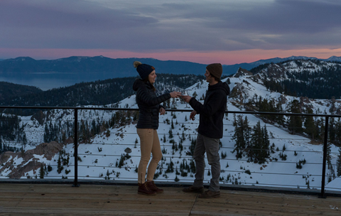 Two people enjoying glasses of champagne at the Sunset Happy Hour.