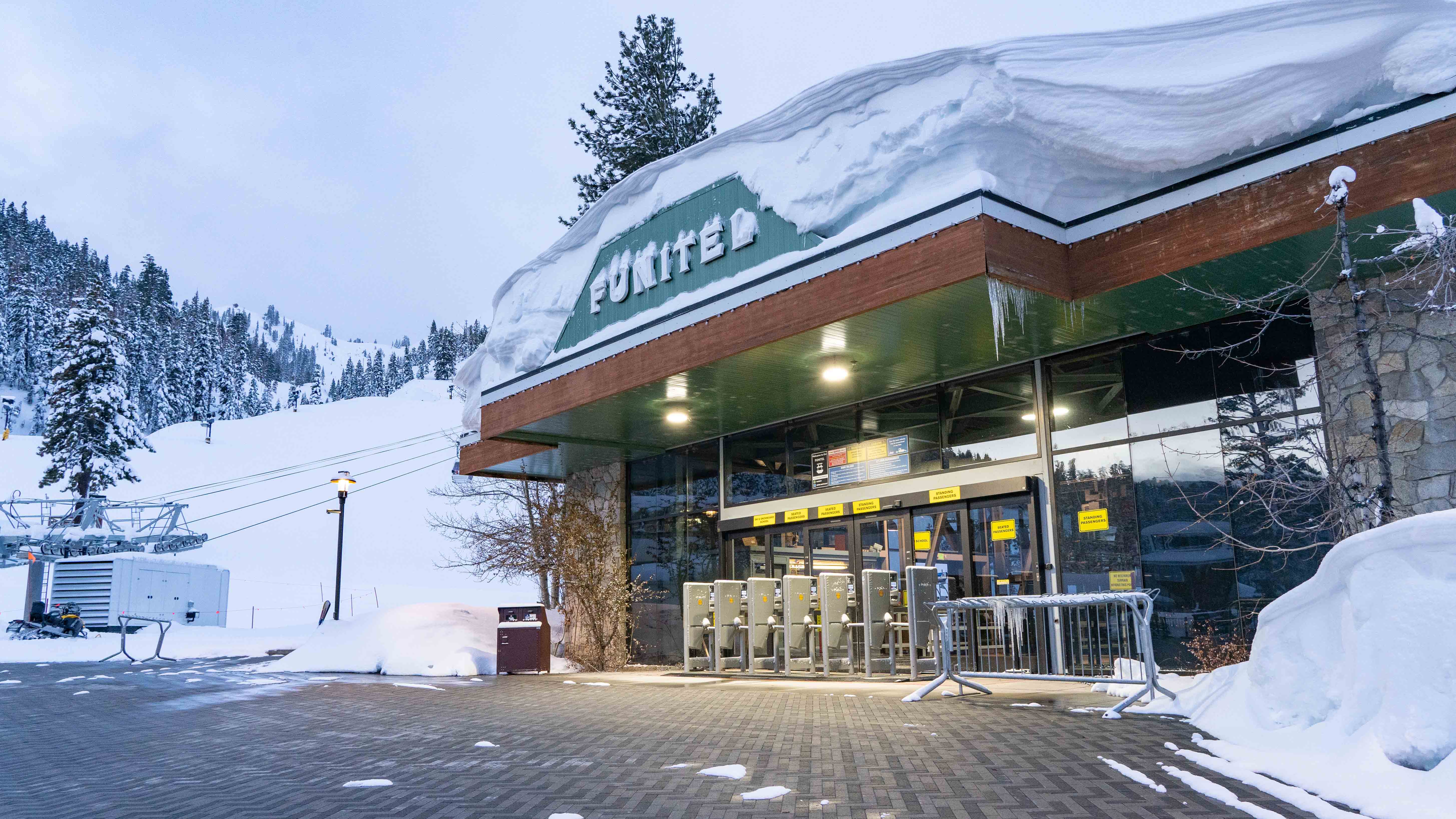 The Village at Palisades Tahoe Funitel building covered in snow. 